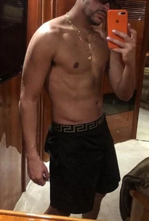 Bad Bunny shirtless mirror selfie in Boxers